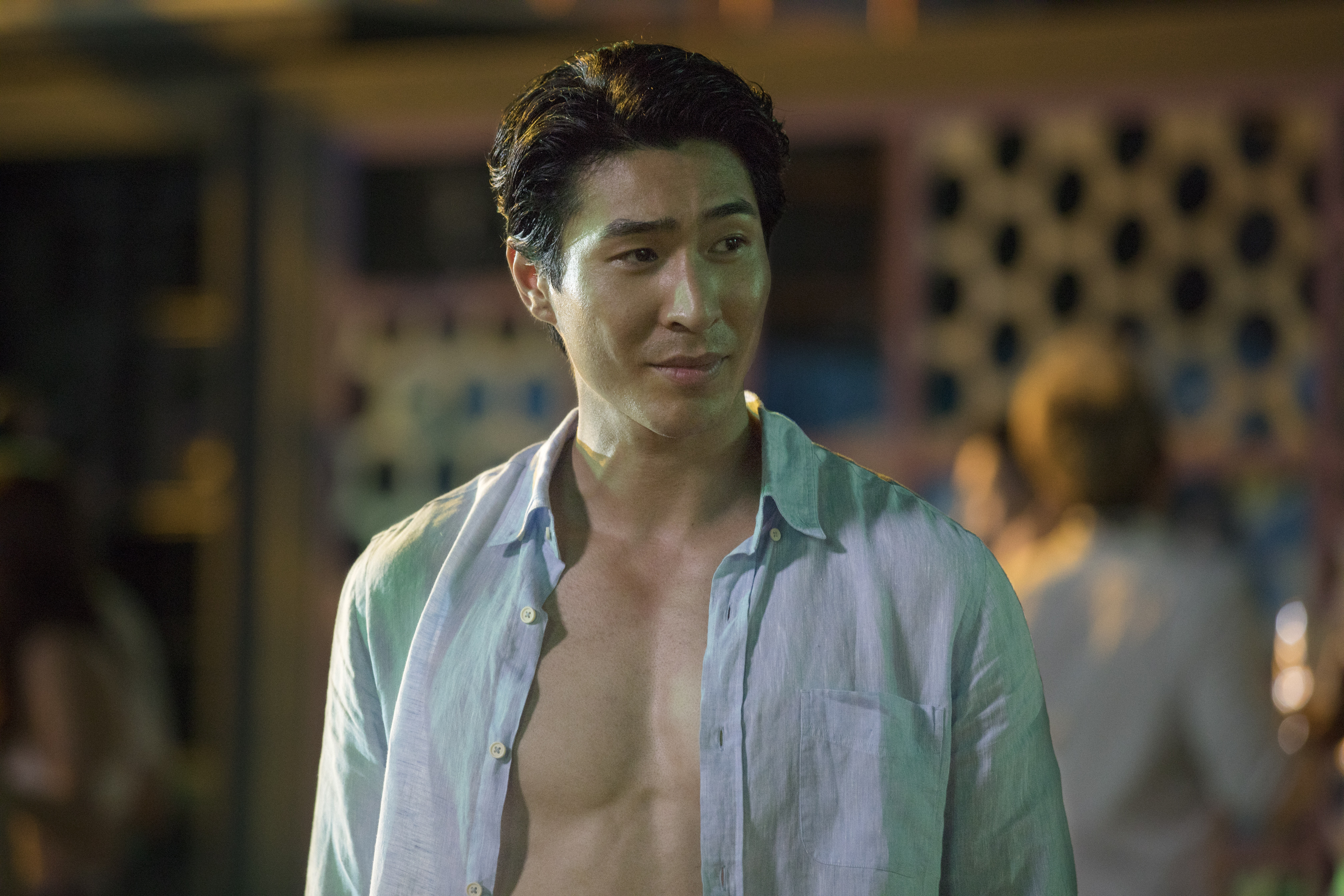 Suave-looking Chris Pang with his blue shirt unbuttoned
