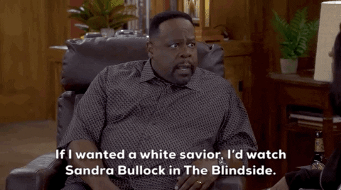 Cedric the Entertainer in a scene from The Neighborhood saying, "If I wanted a white savior, I'd watch Sandra Bullock in The Blindside."
